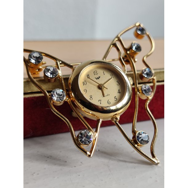 Firserbroche med ur og bling