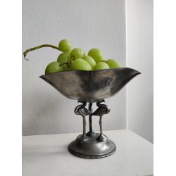 Tinopsats med tre flamingoer