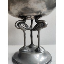 Tinopsats med tre flamingoer