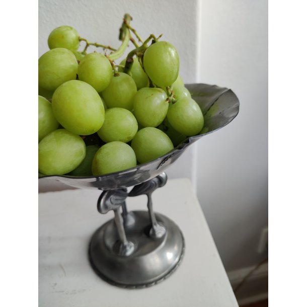 Tinopsats med tre flamingoer