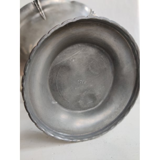 Tinopsats med tre flamingoer