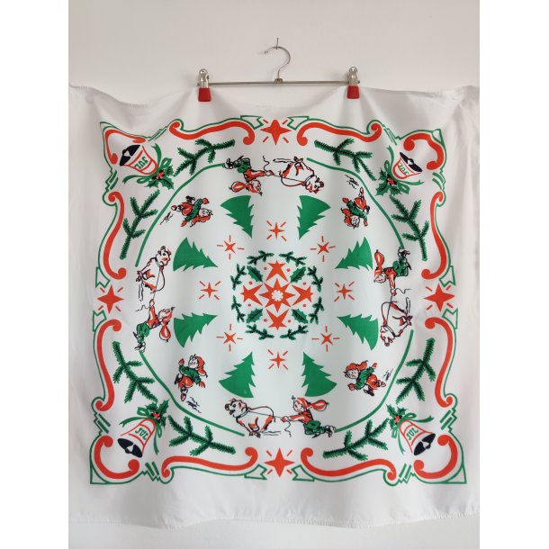 Juledug fra 1950'erne med nisser og grise i galop