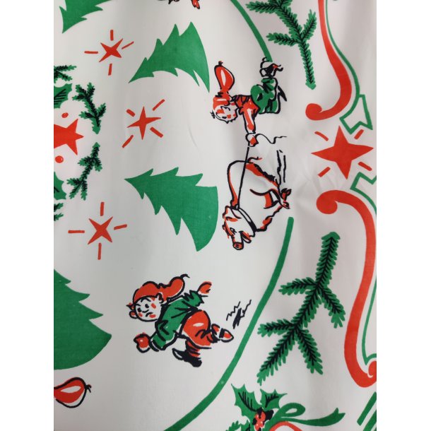 Juledug fra 1950'erne med nisser og grise i galop