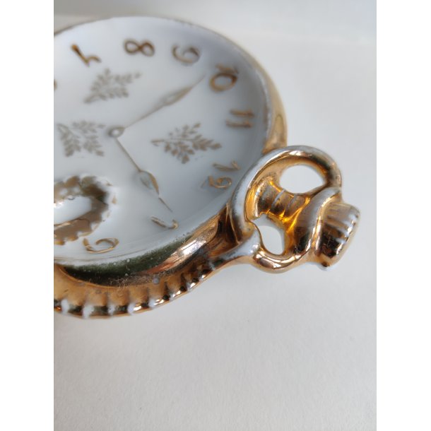 Porcel�ns-holder til lommeur