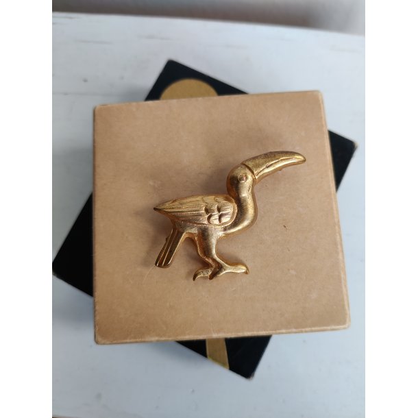 Forgyldt messingbroche med tukan, 1930-1940