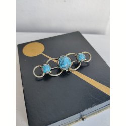 Broche med turkiser