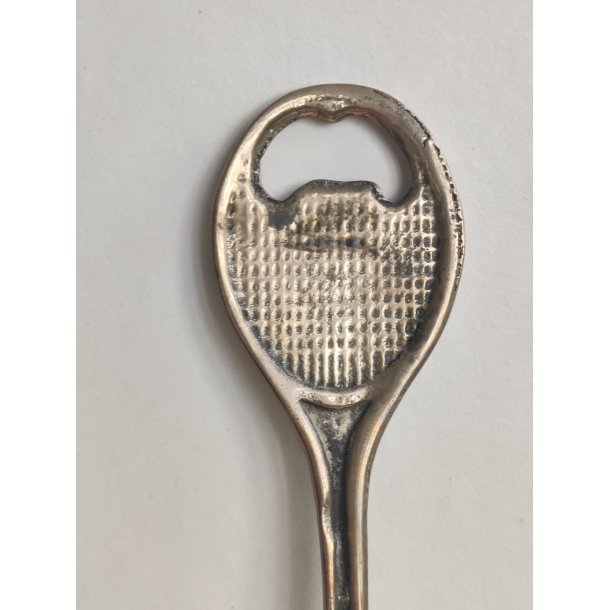 Messing oplukker formet som tennisketcher 